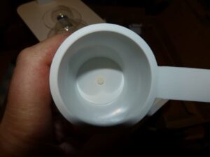 wick at the bottom of the growing cup